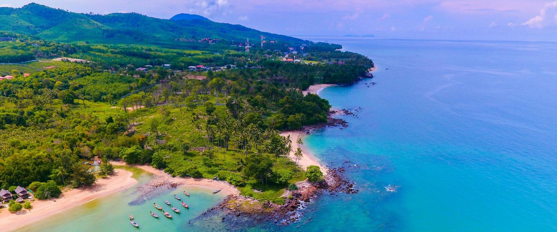 Serene Koh Samui sunset over turquoise waters on a Koh Samui Travel banner by Legend Travel Group.